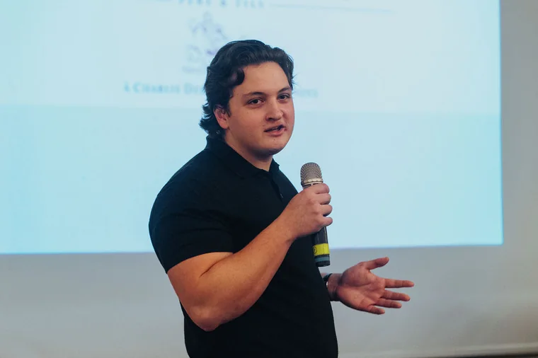 Speaker presenting to a room in Cyprus for a business-focused video brief