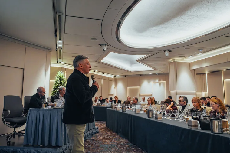 Speaker addressing a room during a Cyprus event highlight shoot