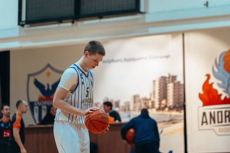 Player preparing to dribble during a Cyprus basketball event